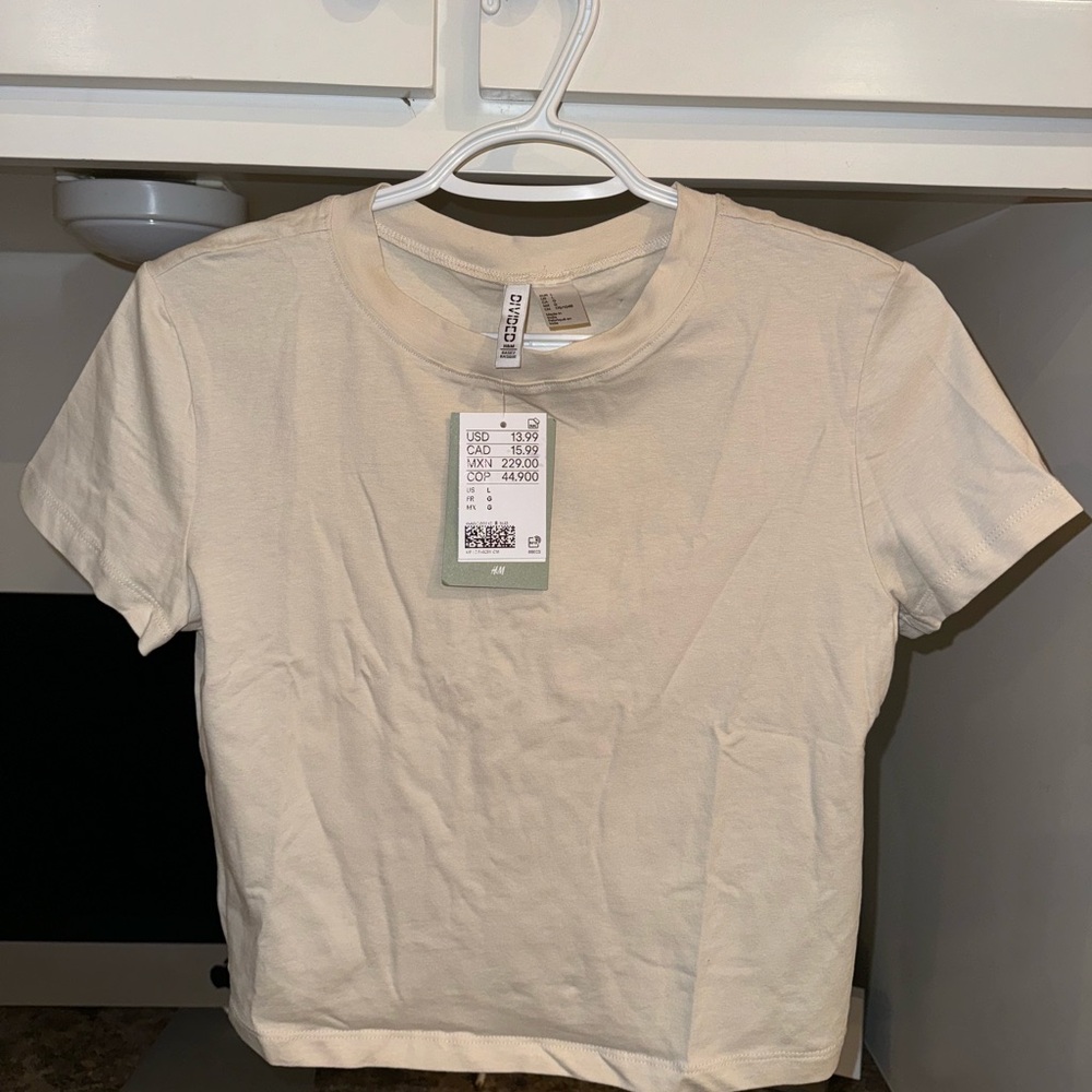 NWT H&M Baby Doll Tee - Size large in cream color